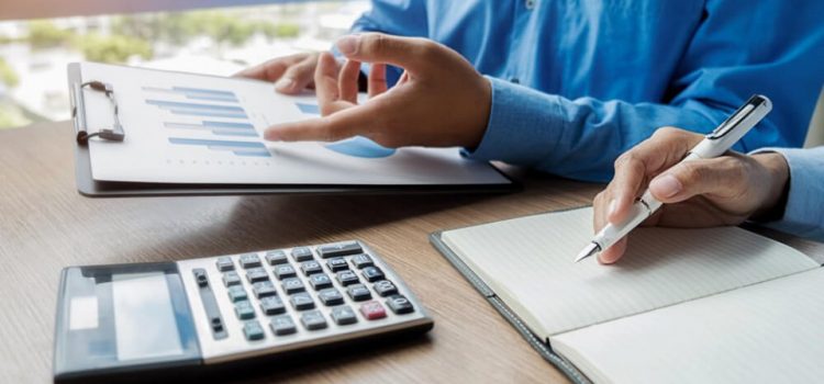Business partners calculating sales tax with robust 3pl management solution.