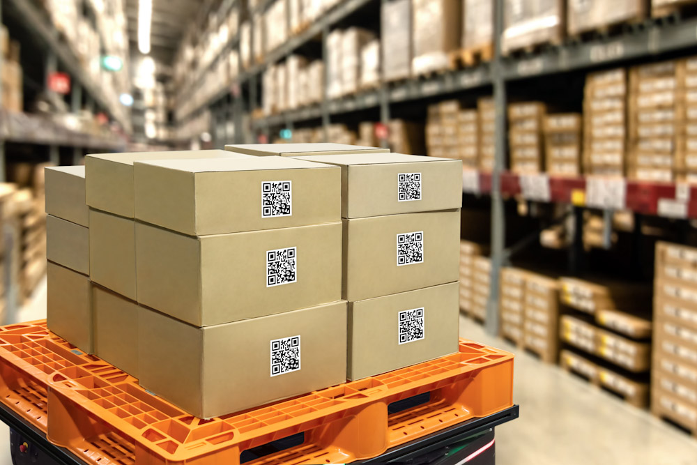 Boxes in a warehouse that utilizes a 3PL warehouse management system for inventory tracking