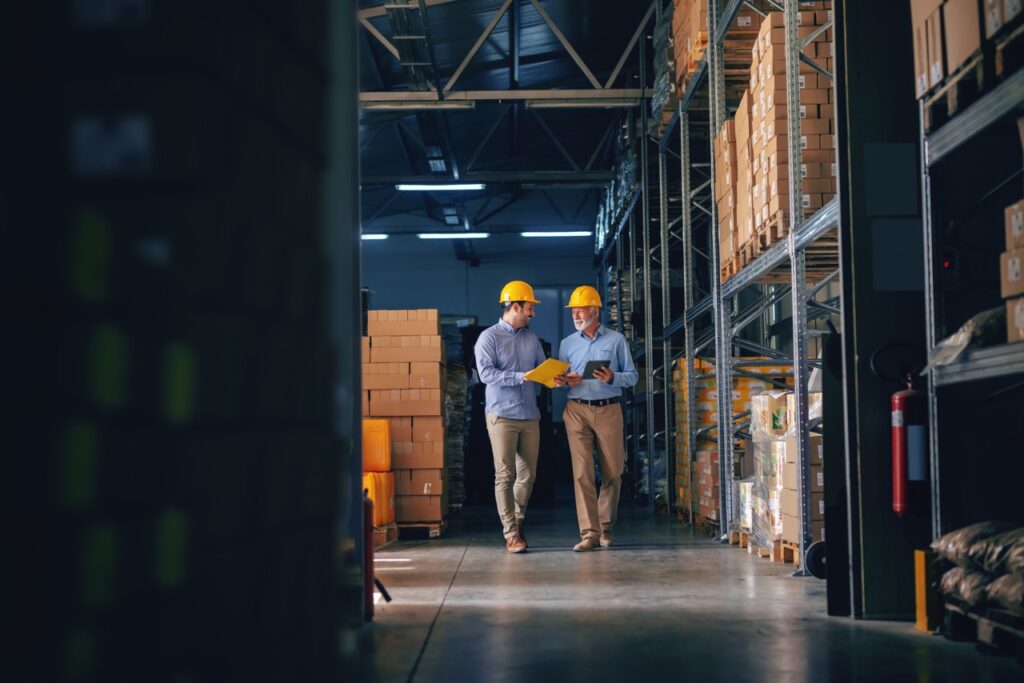 warehouse employees discussing strategy