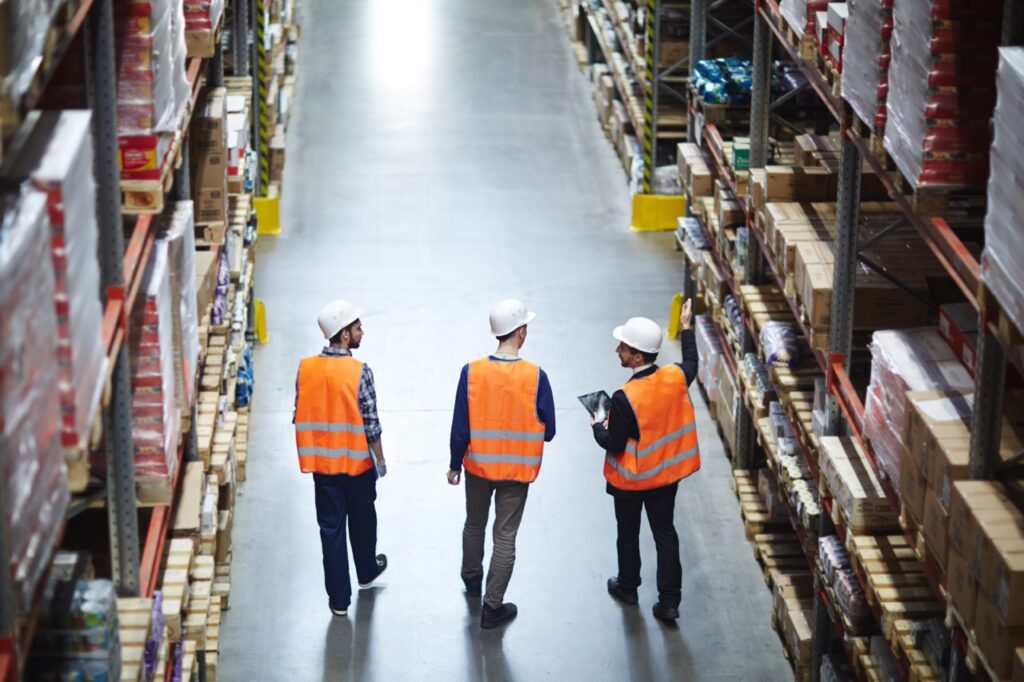 warehouse managers examine warehouse