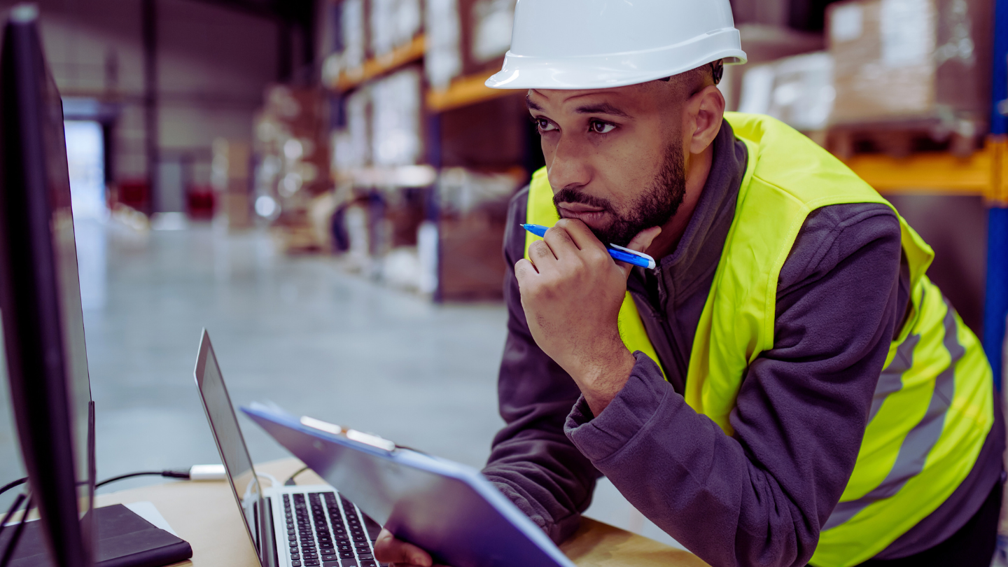 A Warehouse Manager reviewing Distribution Technology Solutions