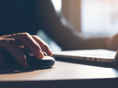 Person typing on a laptop computer